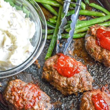 sheet pan meatloaf supper on a metal baking sheet