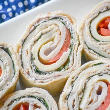 COPYCAT COSTCO TURKEY SWISS PINWHEELS ON A WHITE SERVING DISH