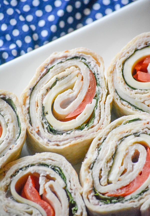 COPYCAT COSTCO TURKEY SWISS PINWHEELS ON A WHITE SERVING DISH