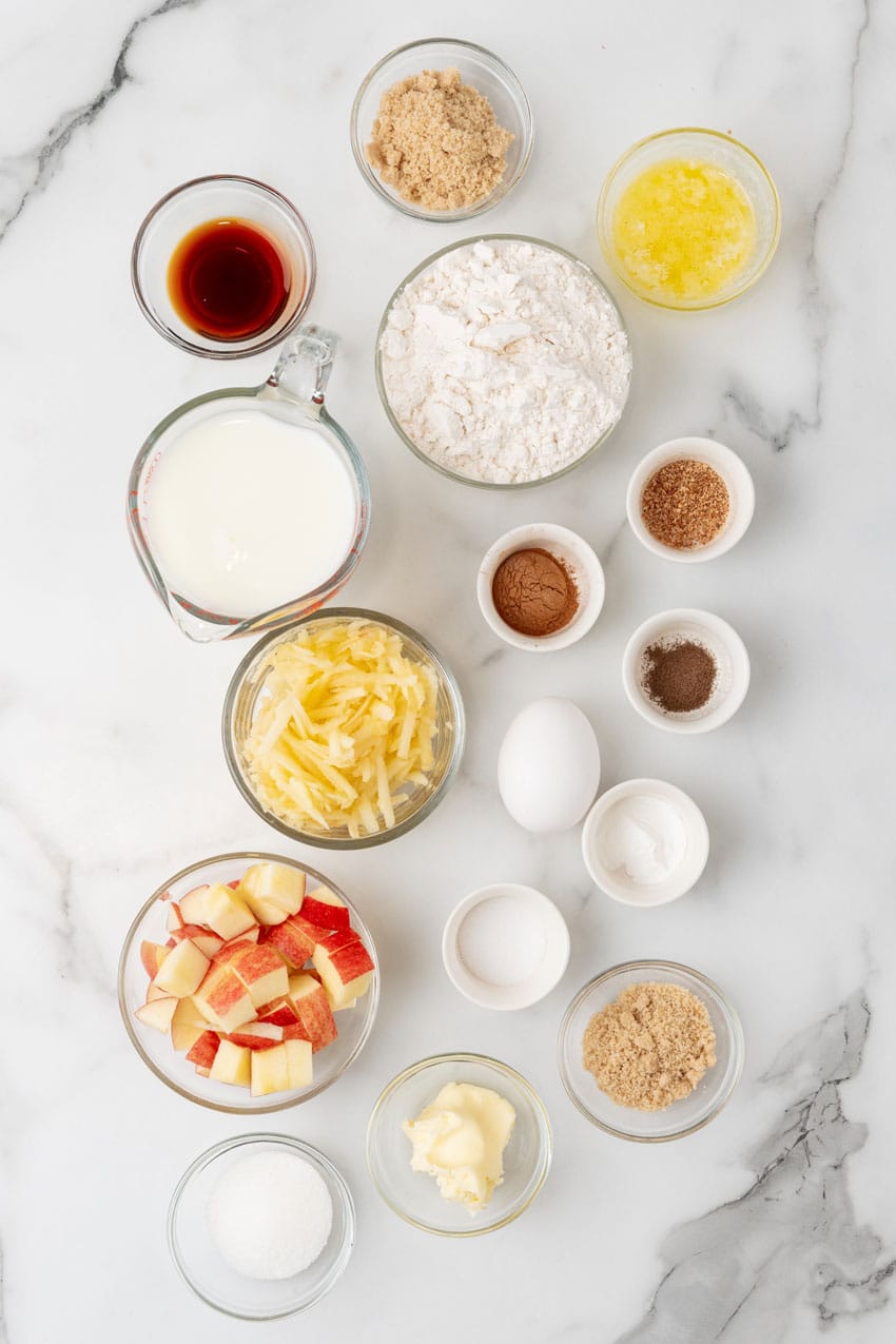 an overhead image showing the measured ingredients needed to make a batch of apple pie pancakes