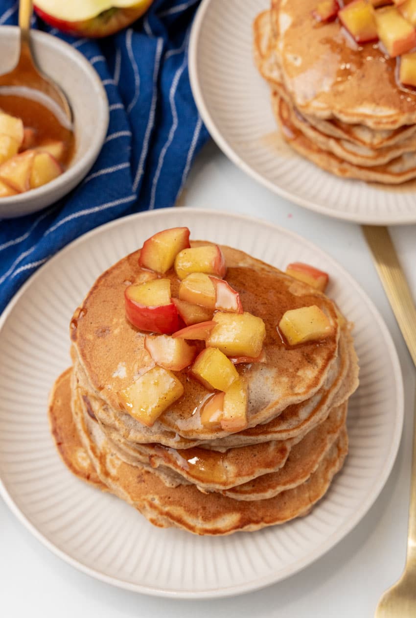 stacks of homemade apple pie pancakes on small white plates