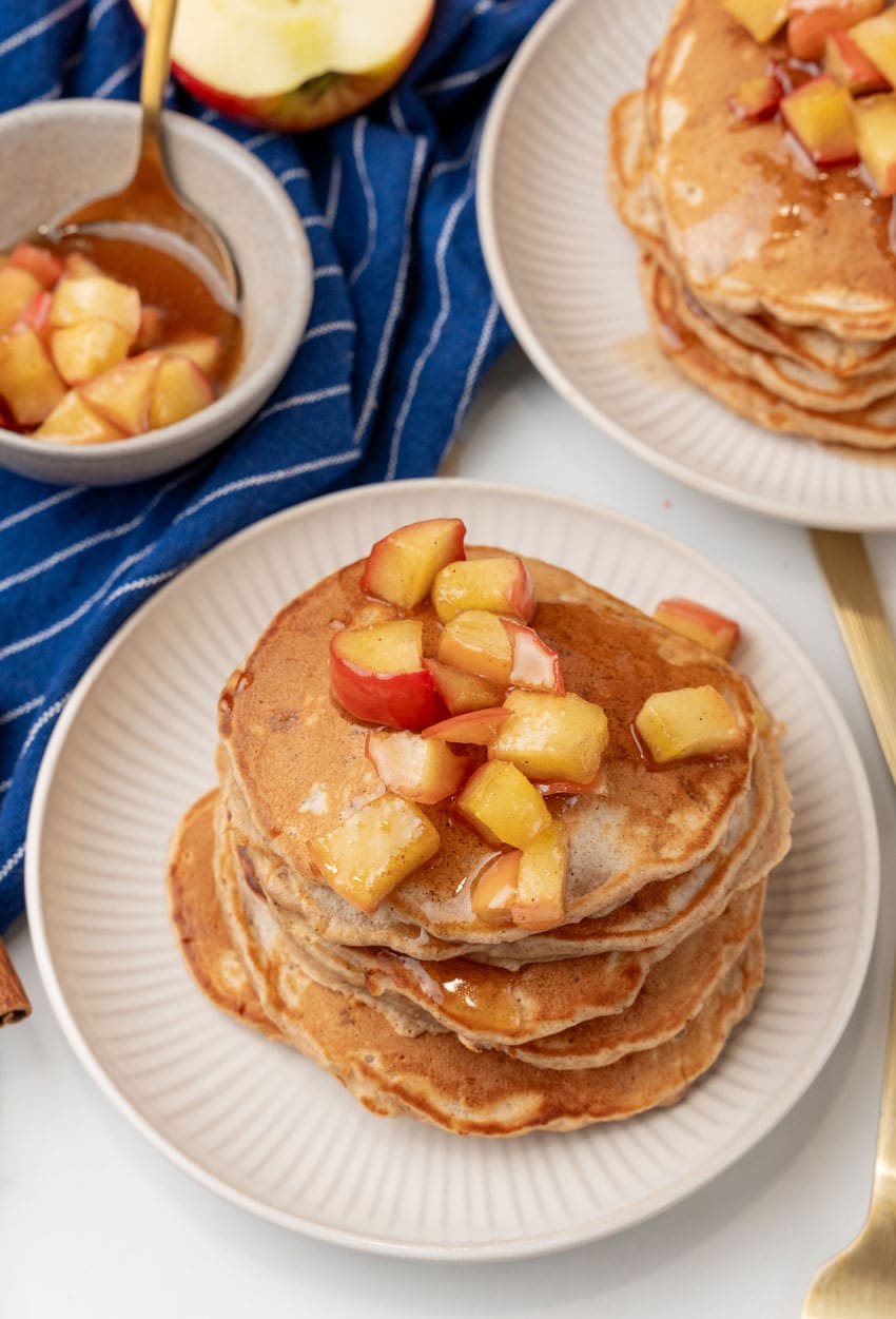 stacks of homemade apple pie pancakes on small white plates
