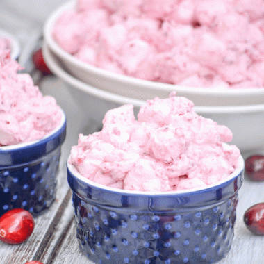 cranberry fluff salad in a tiny blue bowl