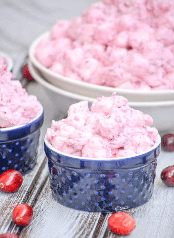 cranberry fluff salad in a tiny blue bowl