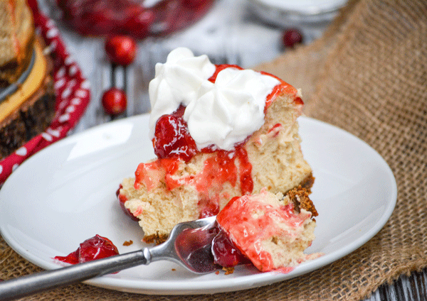 Cranberry Sauce Topped Eggnog Cheesecake