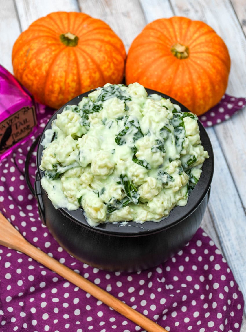 witch Halloween mac and cheese in a black plastic cauldron