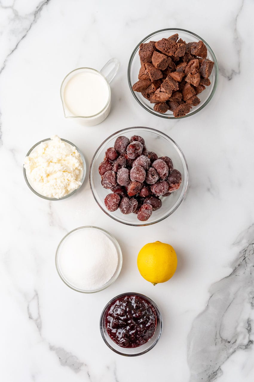 an overhead image showing the measured ingredients necessary to make black forest cherry cheesecake cups