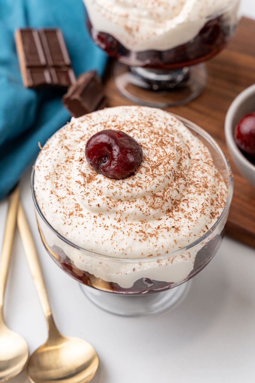 black forest cherry cheesecake cup on a marble countertop