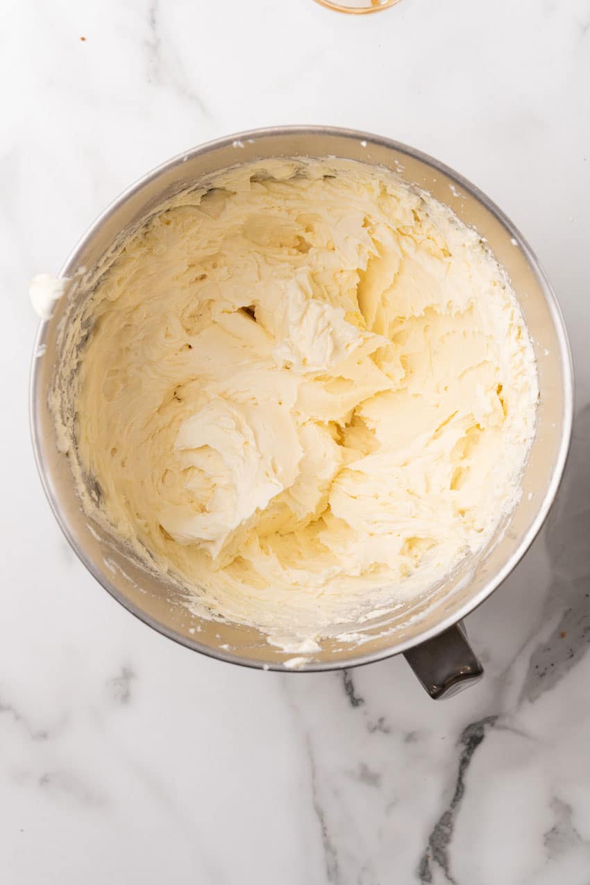 whipped cream cheese in the bowl of a stand mixer