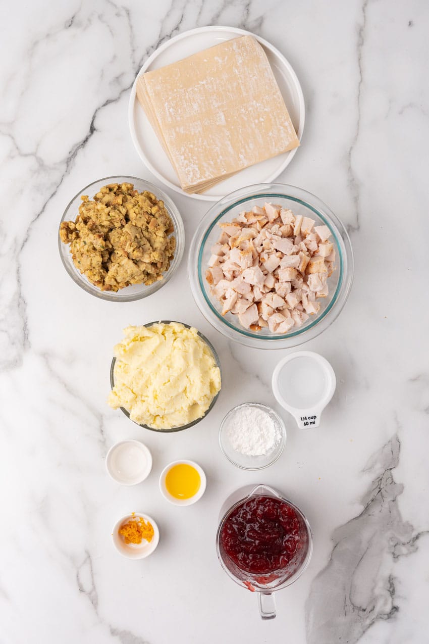 an overhead image showing the measured ingredients needed to make a batch of thanksgiving egg rolls