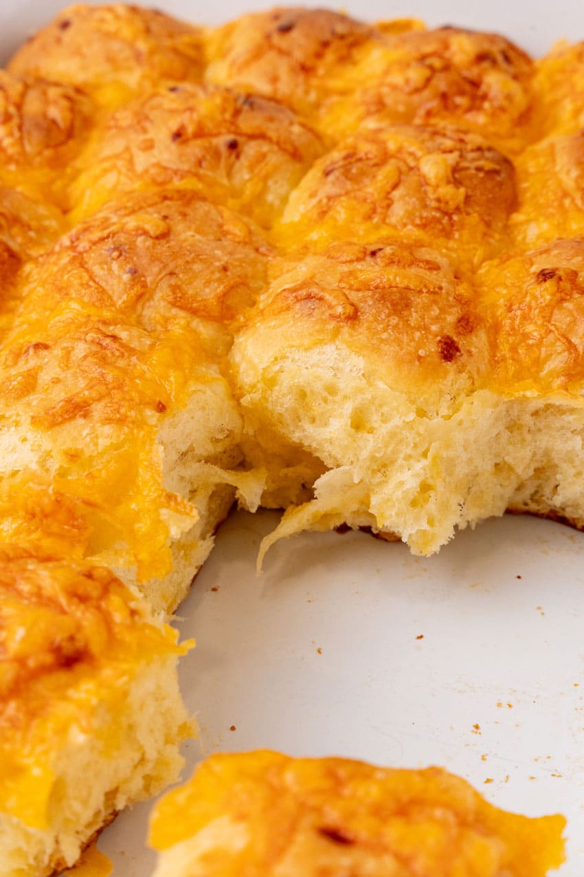 cheesy potato pull apart rolls on a white counter top