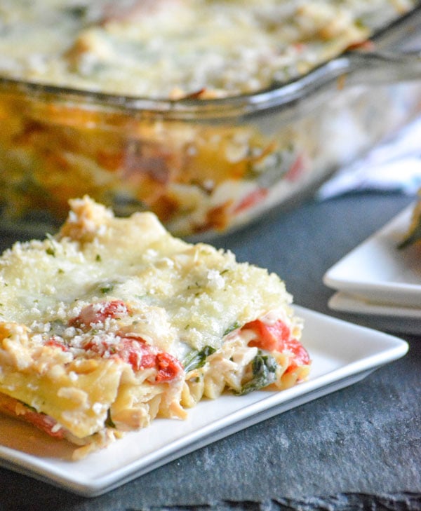 a piece of Chicken Caesar Lasagna served on a white square plate