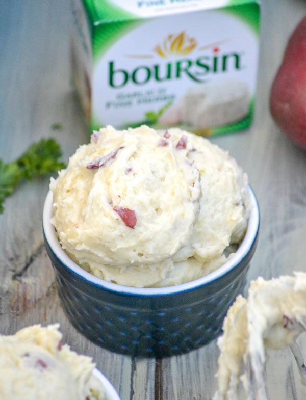 creamy boursin cheese whipped red potatoes in a blue ramekin