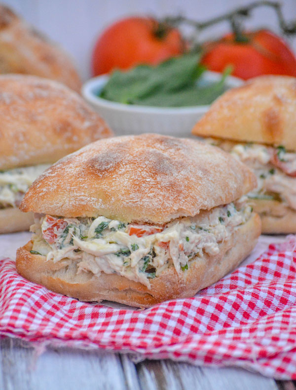 Spinach & Tomato Tuna Salad Sandwiches shown with a red checkered cloth napkin