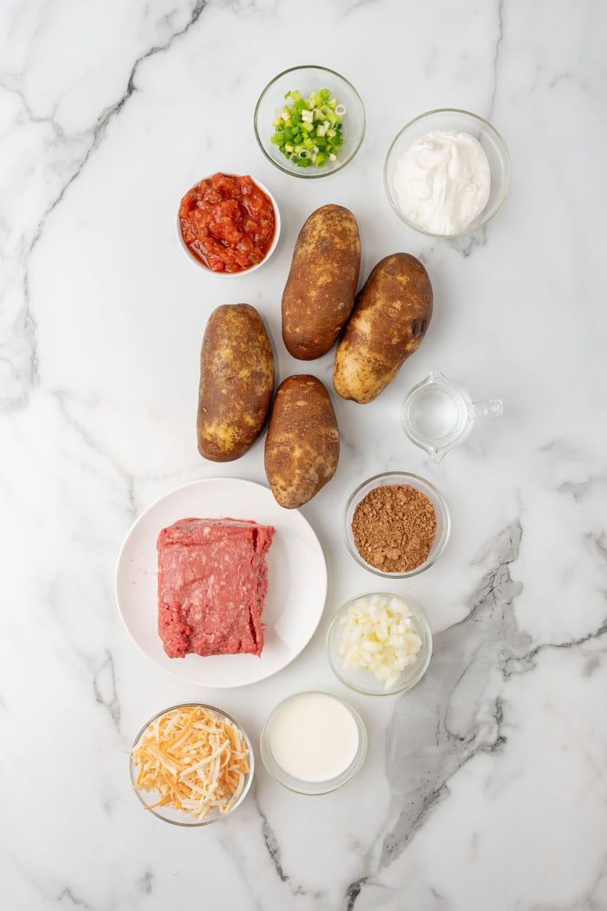 an overhead image showing the measured ingredients needed to make a batch of twice baked taco potatoes