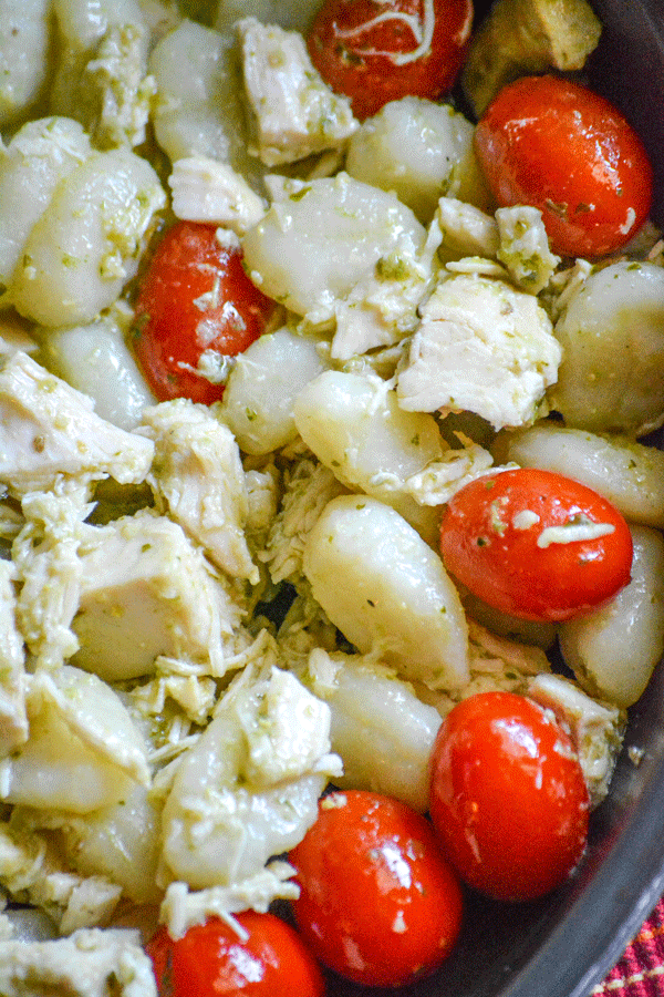 chicken pesto gnocchi in a black skillet