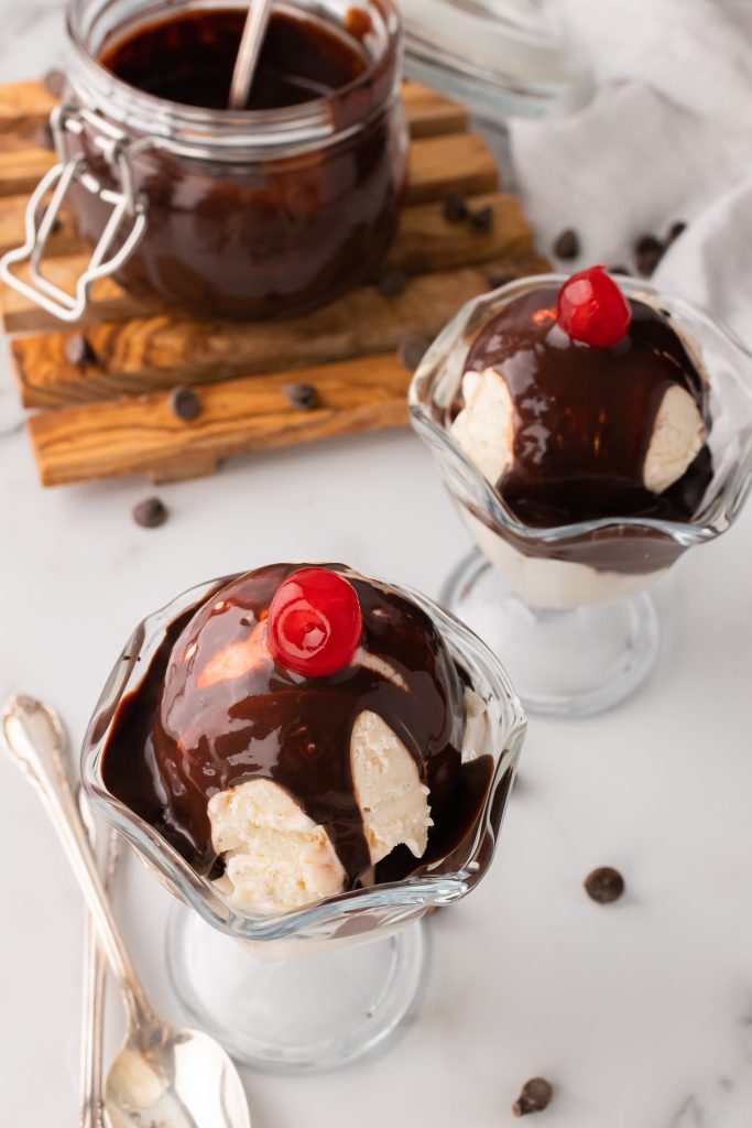 Bailey's Irish cream chocolate sauce served over scoops of ice cream in glass bowls