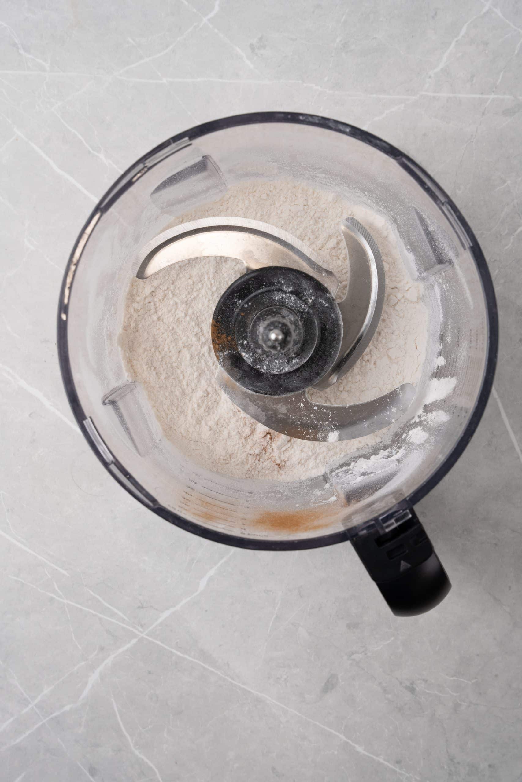 seasoned flour in the bowl of a food processor fitted with the blade attachment