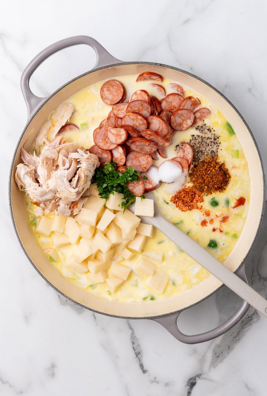 cajun pot pie filling in a large cast iron skillet