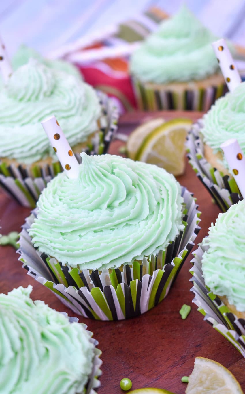 margarita cupcakes on a wooden cake stand