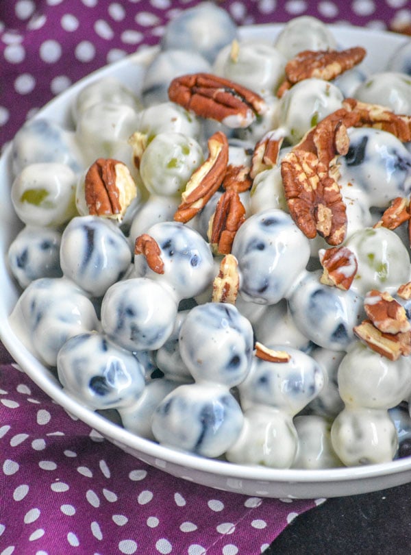 SOUTHERN SOUR CREAM GRAPE SALAD IN A WHITE BOWL