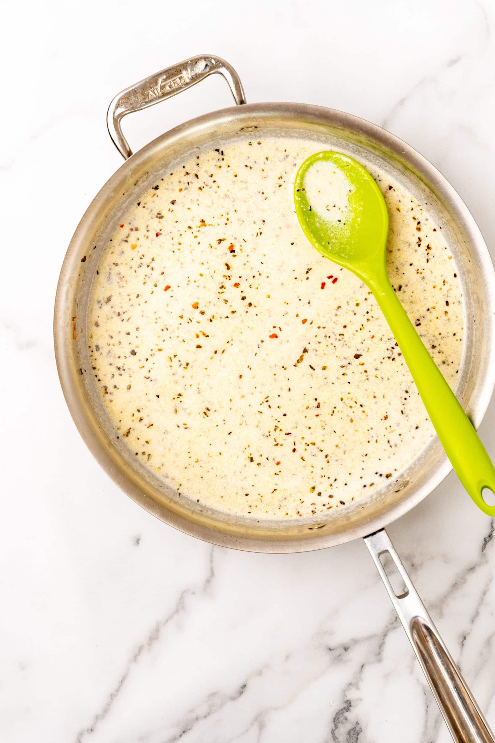 creamy scampi sauce in a large silver skillet