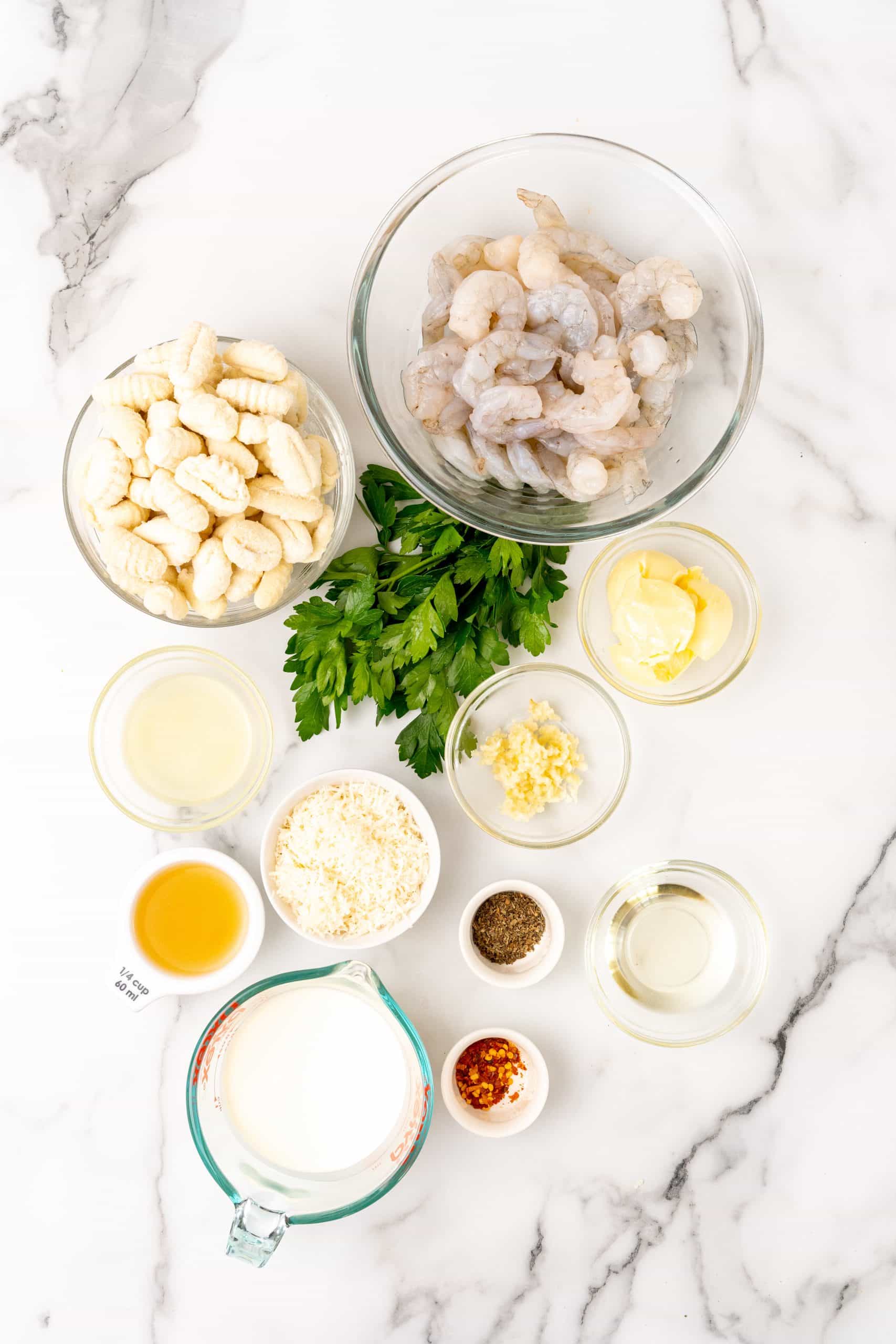 an overhead image showing the measured ingredients needed to make gnocchi shrimp scampi