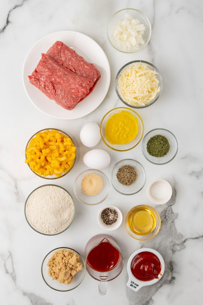 an overhead image showing the measured ingredients needed to make a mac and cheese stuffed meatloaf