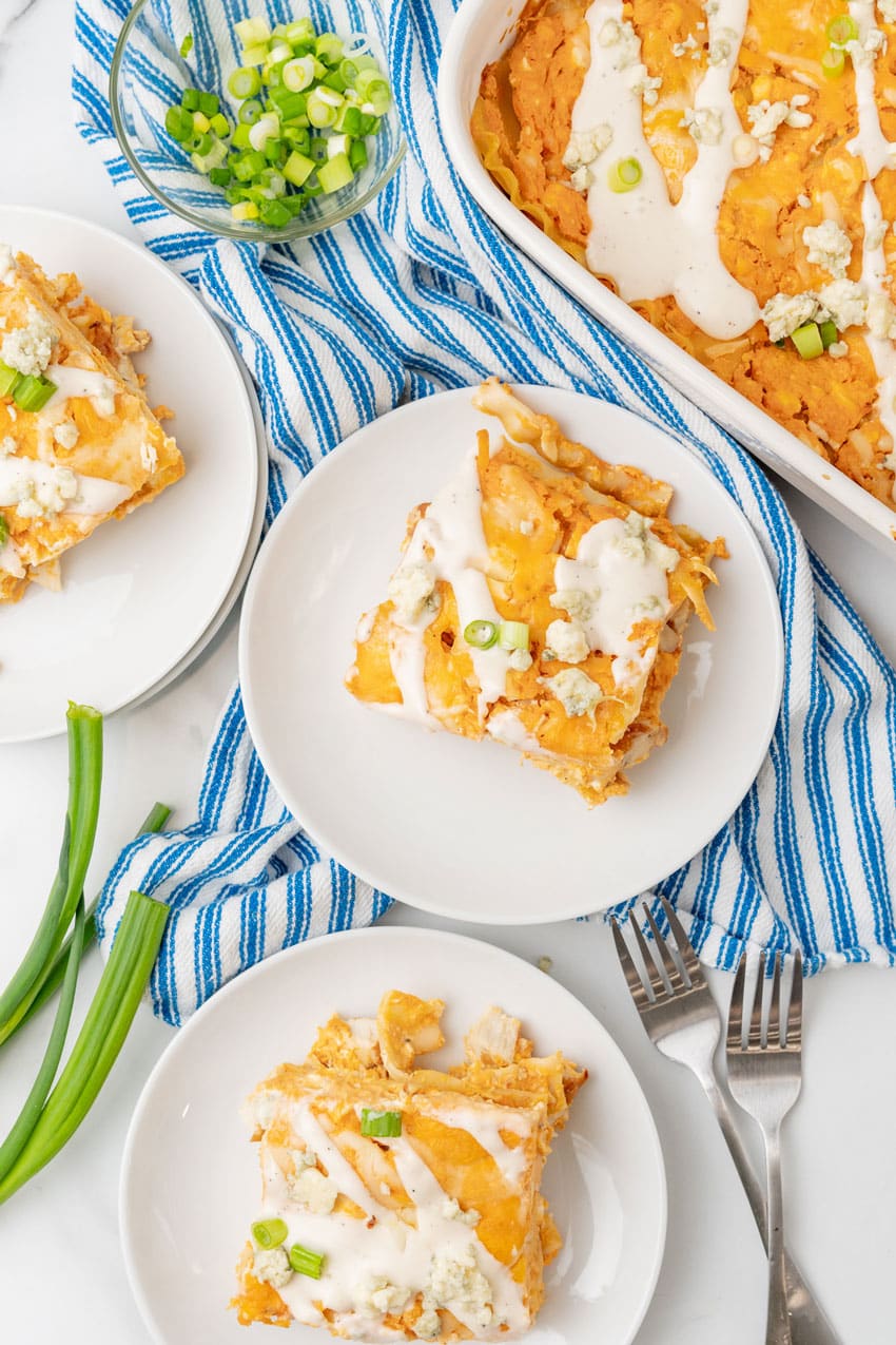 slices of cheesy buffalo chicken lasagna on small white plate