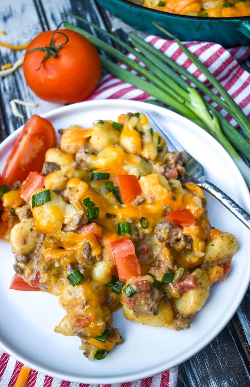 cheeseburger gnocchi skillet recipe served on a small white plate with a silver fork on the side