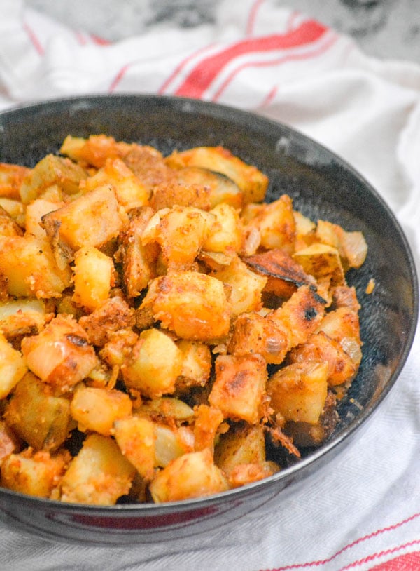 DINER STYLE BREAKFAST HOME FRY POTATOES IN A BLUE BOWL