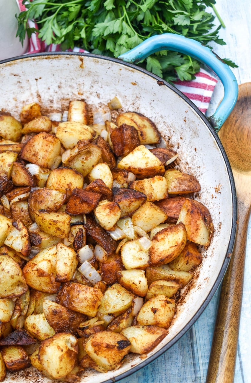 DINER STYLE HOME FRIED BREAKFAST POTATOES IN A CAST IRON SKILLET