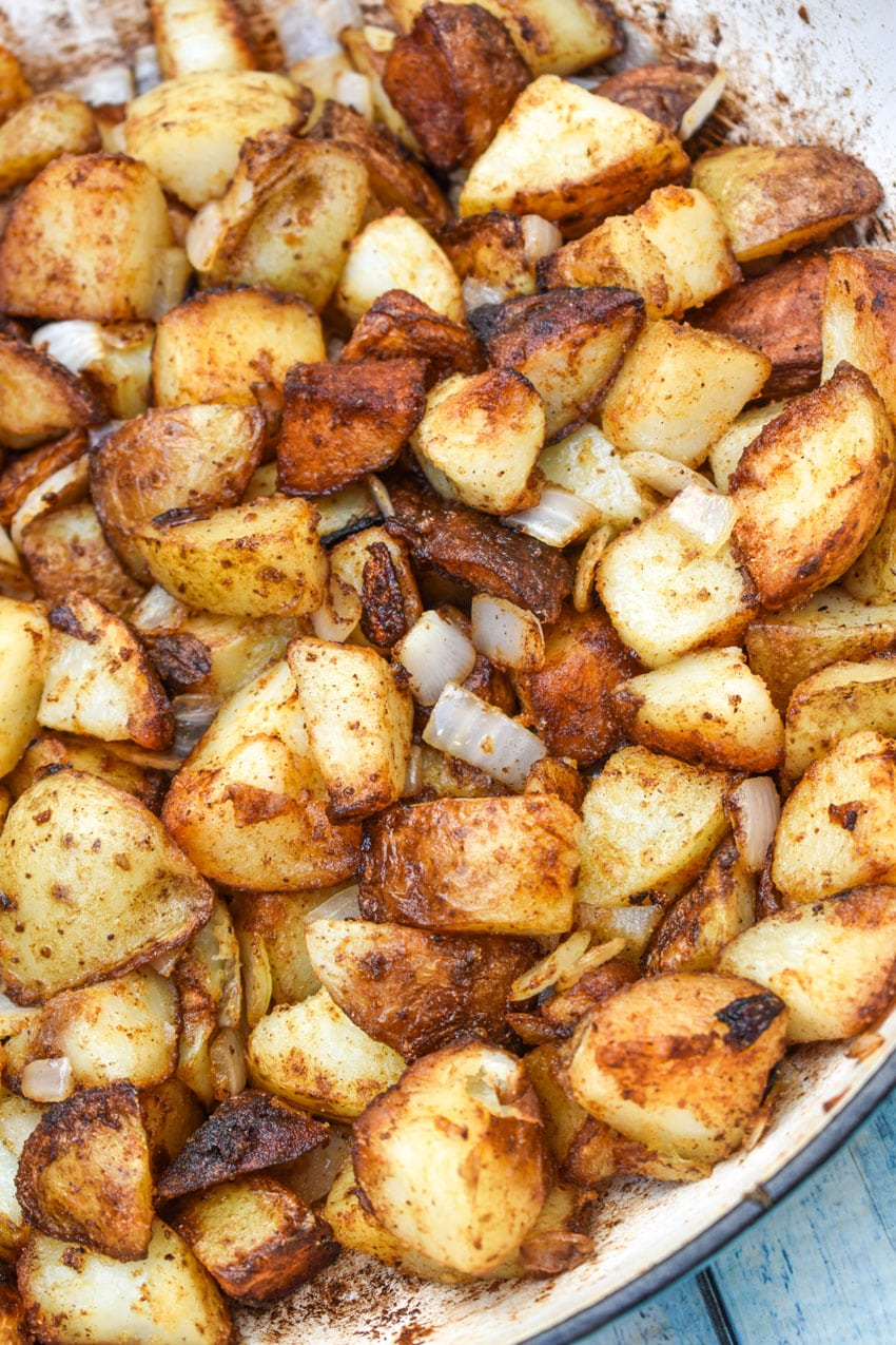 DINER STYLE HOME FRIED BREAKFAST POTATOES IN A CAST IRON SKILLET