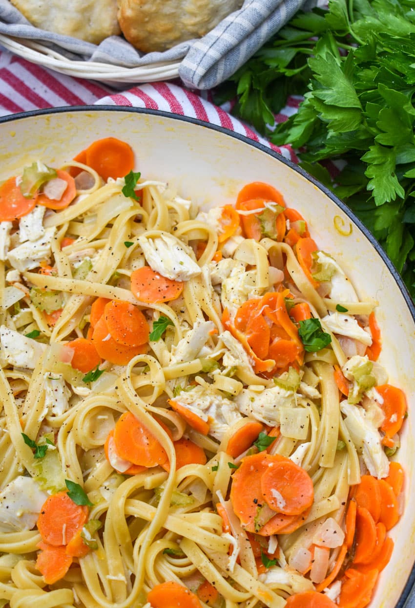 creamy chicken and vegetable pasta in a large cast iron skillet