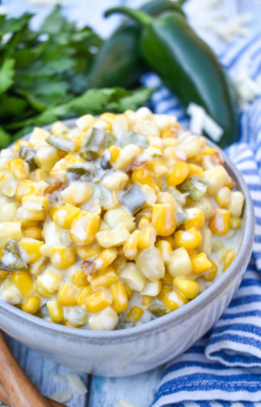smoked jalapeno cheddar creamed corn in a small gray bowl