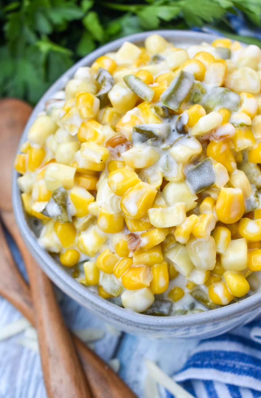 smoked jalapeno cheddar creamed corn in a small gray bowl