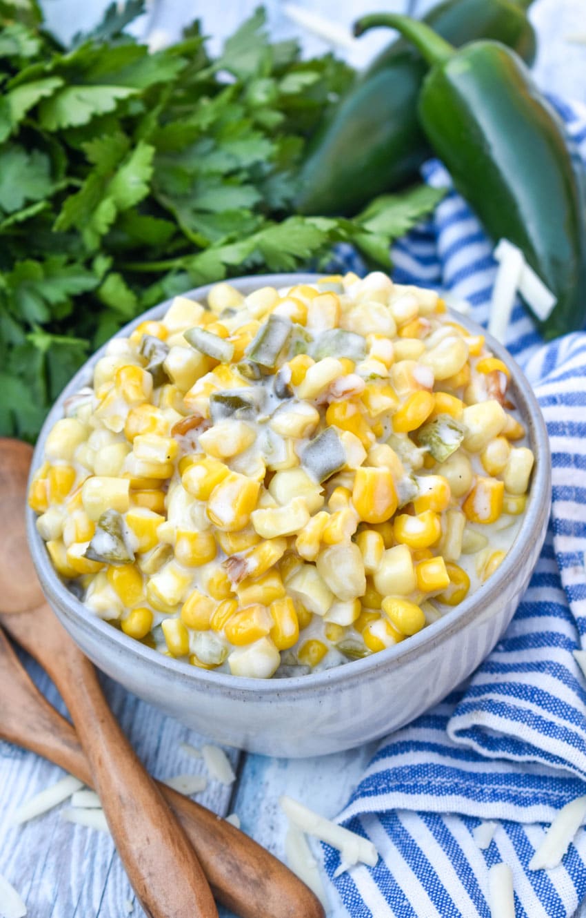 smoked jalapeno cheddar creamed corn in a small gray bowl