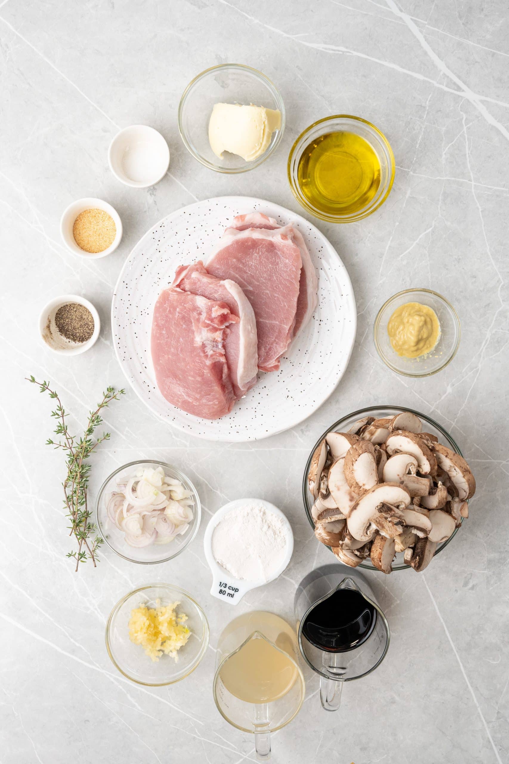 an overhead image showing the measured ingredients needed to make a batch of pork marsala