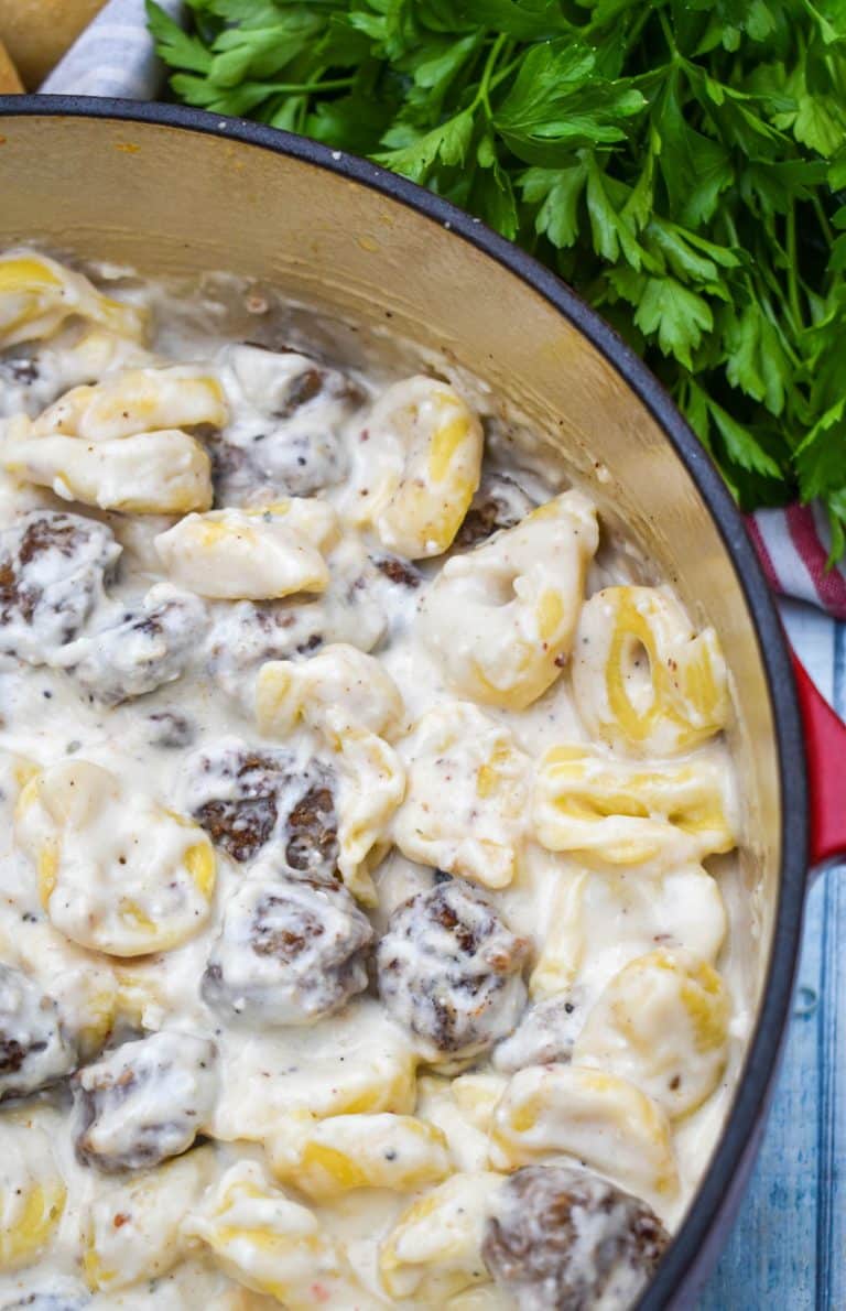 sausage tortellini alfredo in a large dutch oven