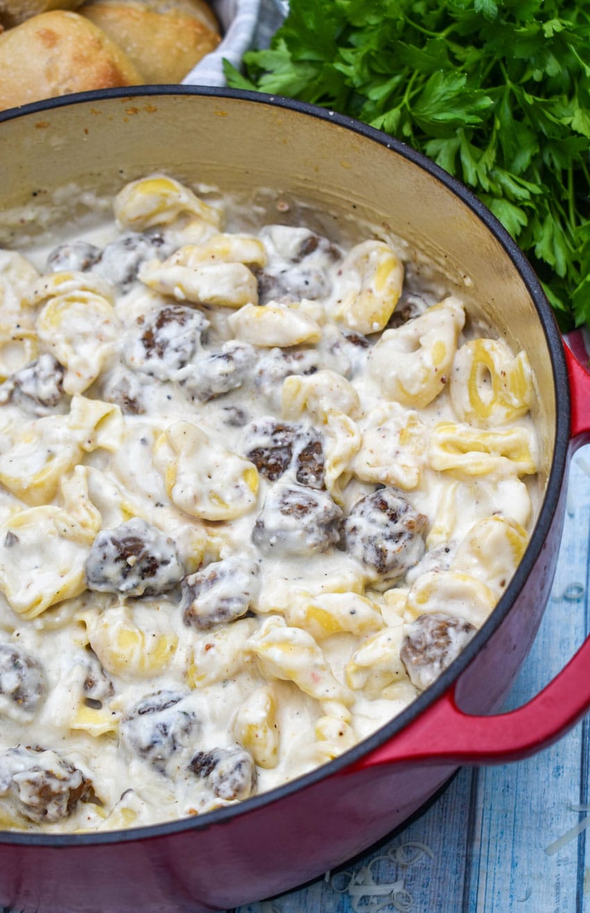 sausage tortellini alfredo in a large dutch oven