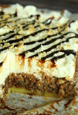 smores poke cake with a slice removed to show the inside