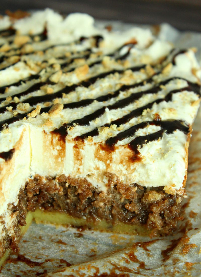 smores poke cake with a slice removed to show the inside