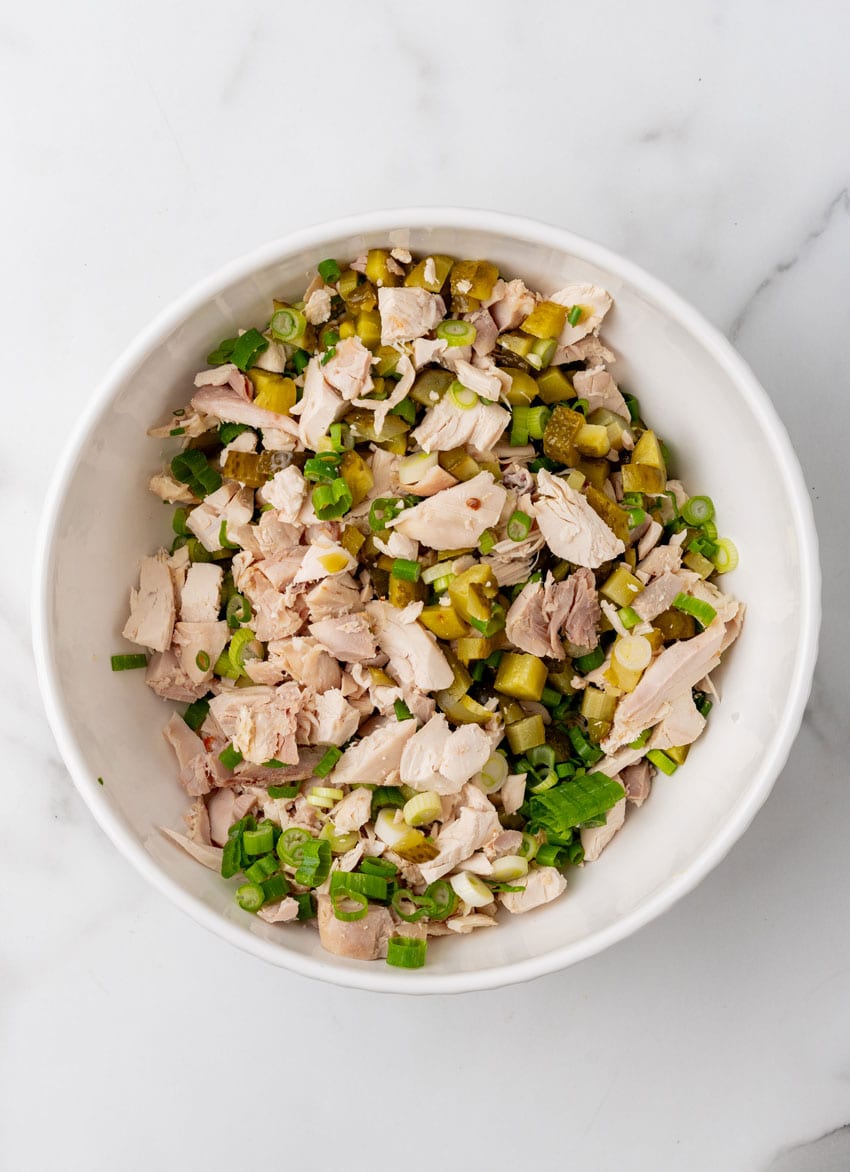 chopped chicken, pickles, and green onions in a large mixing bowl