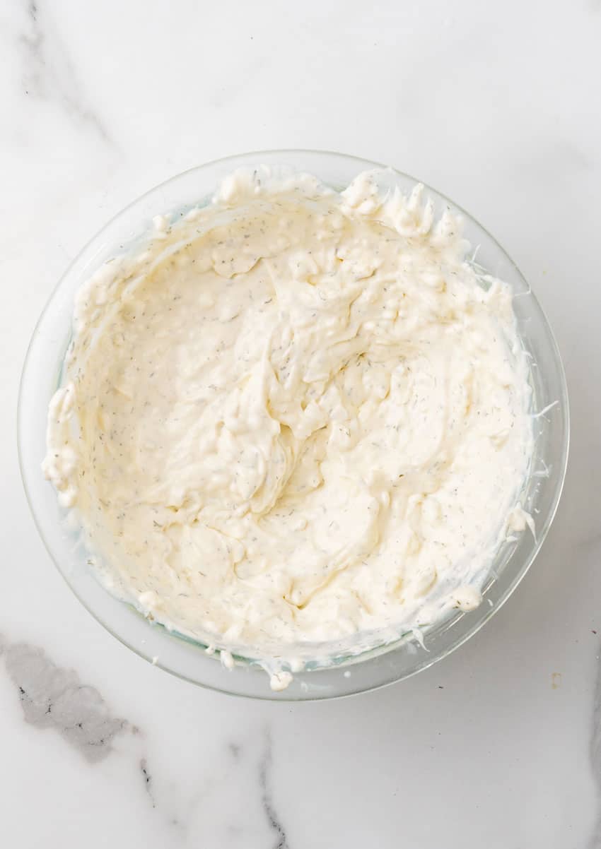 creamy dill dressing in a glass mixing bowl