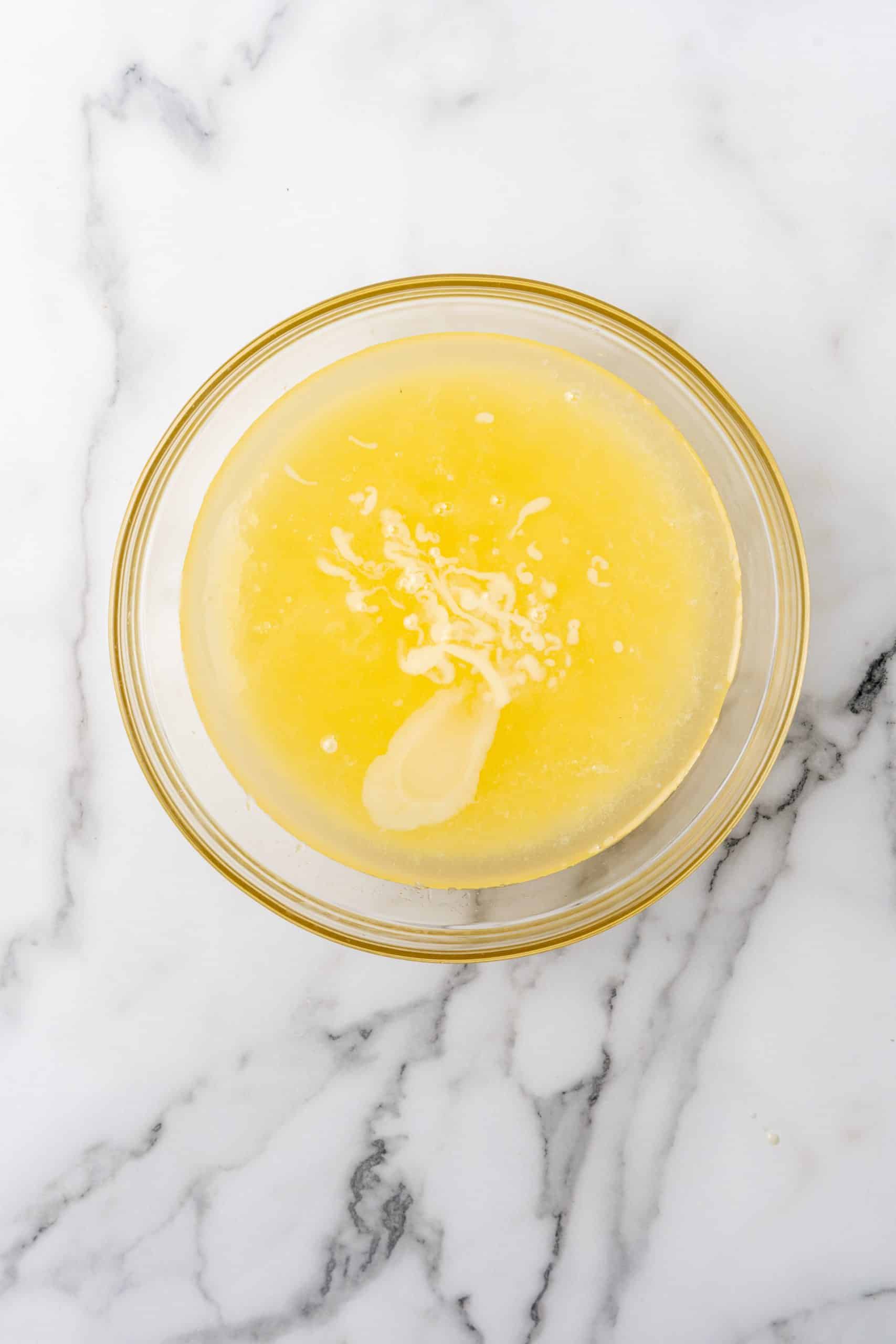 lemonade concentrate in a glass mixing bowl