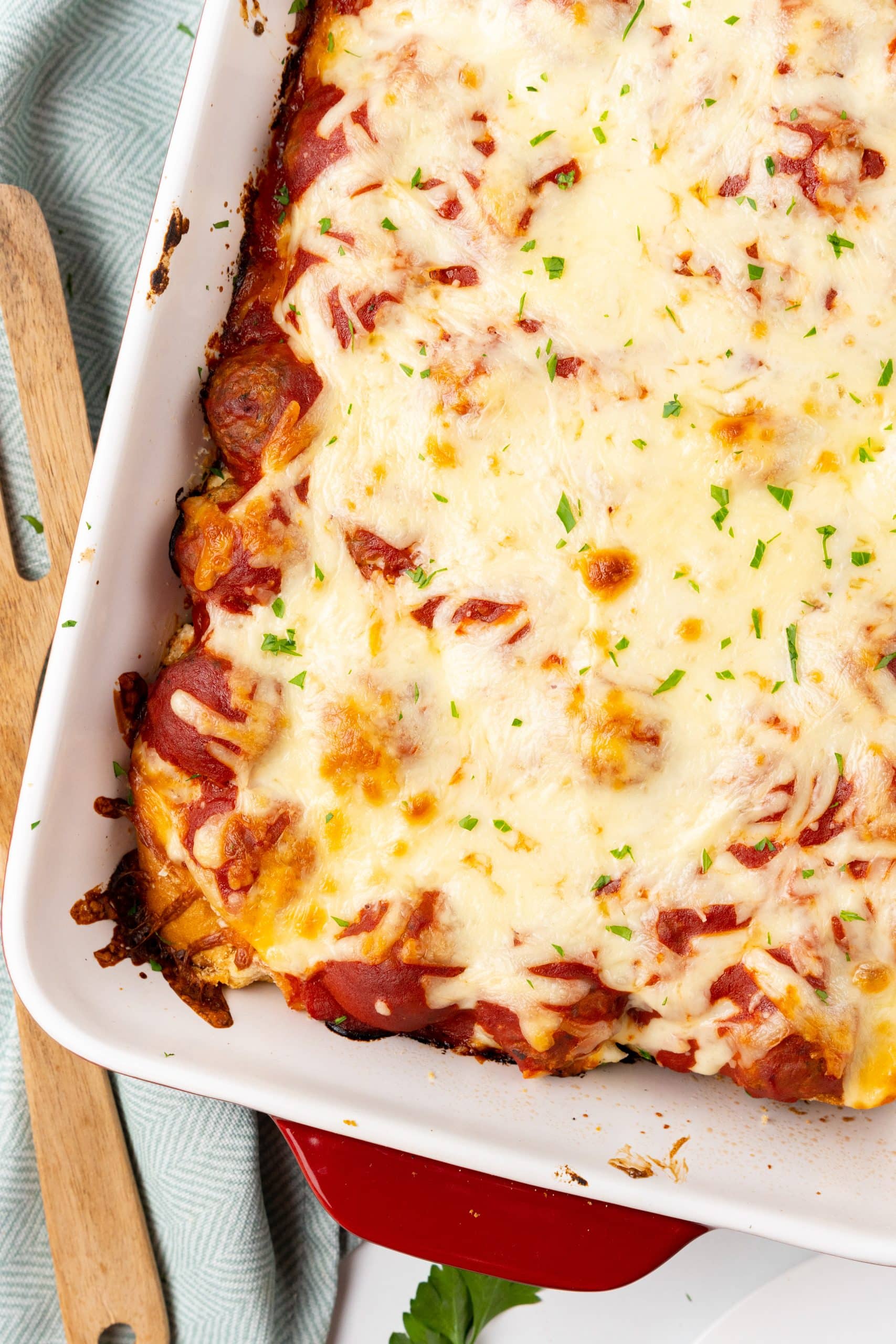 baked meatball sub casserole in a large white baking dish