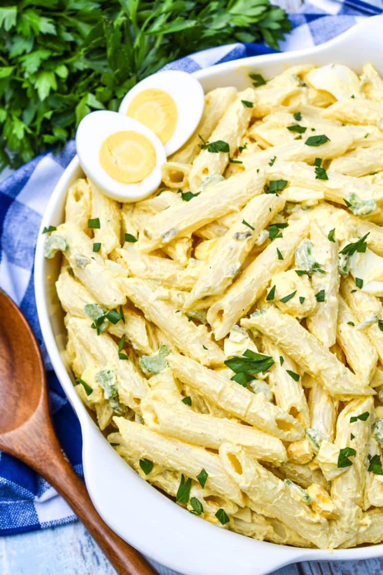 deviled egg pasta salad in a large white serving bowl