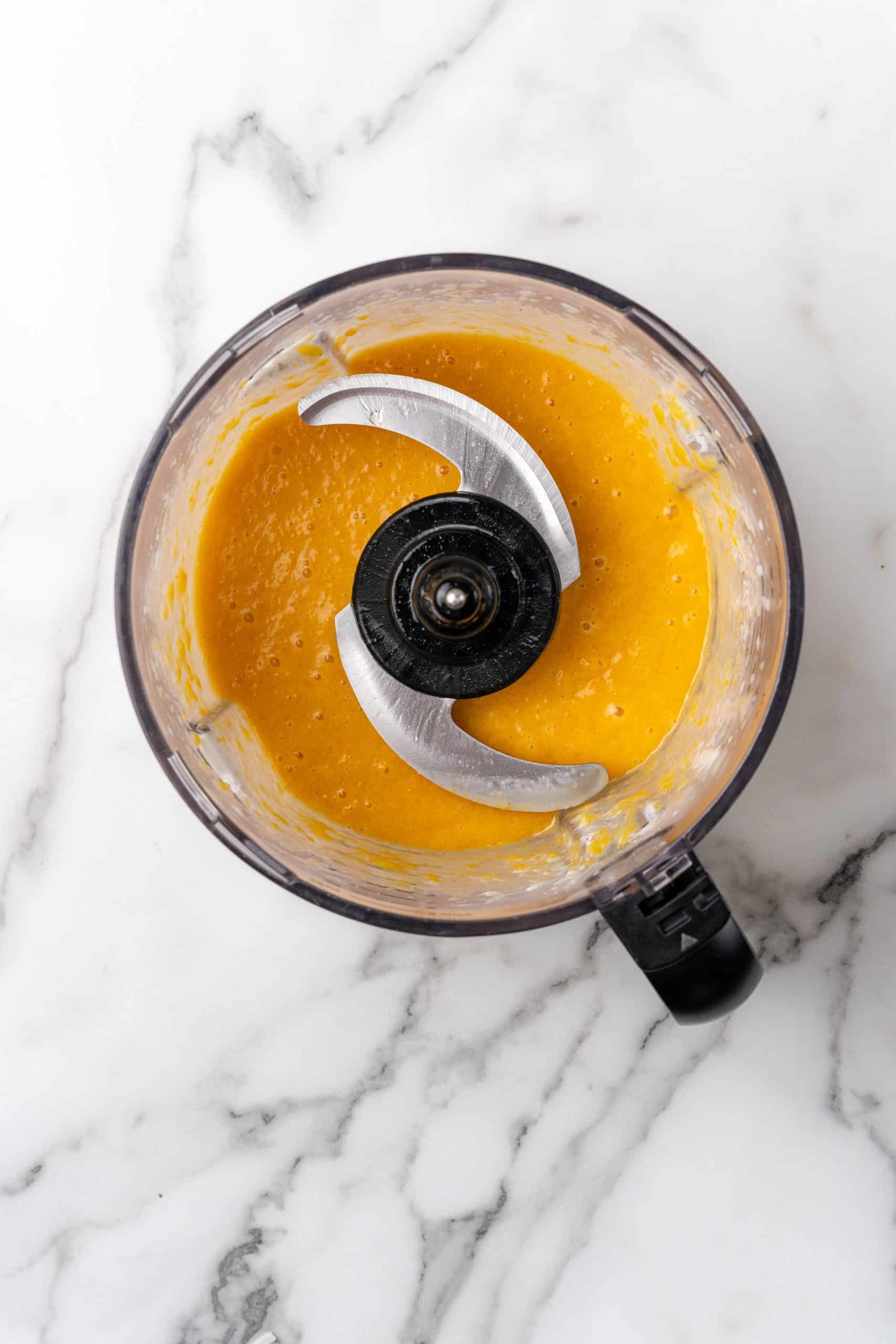 peach puree in the bowl of a food processor