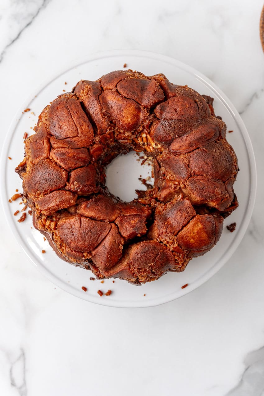 chocolate monkey bread on a white cake stand