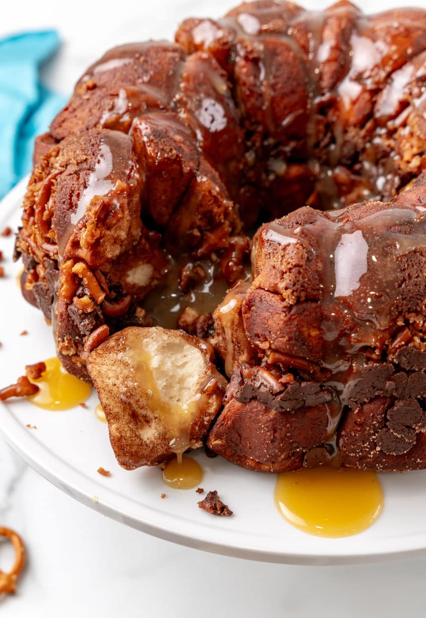 chocolate monkey bread on a white cake stand